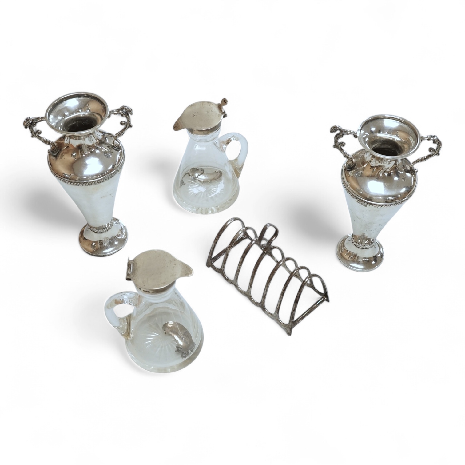 A pair of Edwardian silver mounted whisky noggins by J & J Maxfield Ltd, Birmingham, 1908, one damaged and a pair of matching silver 'Whisky' wine labels, together with a pair of late Victorian silver posy vases by Willi